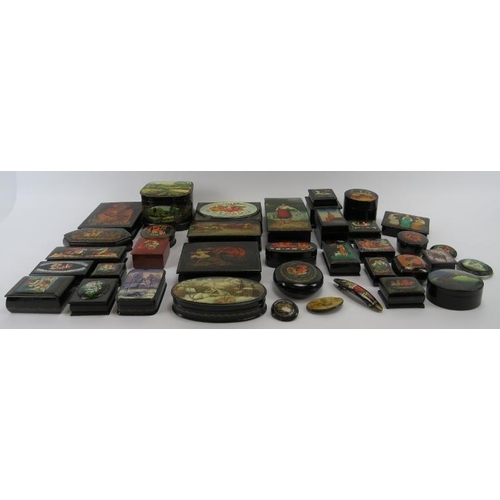 95 - Collection of thirty six Russian lacquer papier Mache boxes, hair slides, brooches, some signed. (36... 