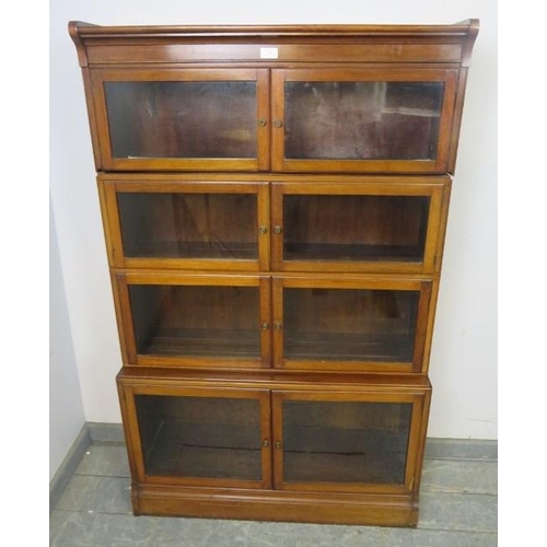 702 - An Edwardian mahogany four-section stacking solicitor’s bookcase, each shelf having twin glazed door... 