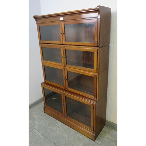 702 - An Edwardian mahogany four-section stacking solicitor’s bookcase, each shelf having twin glazed door... 