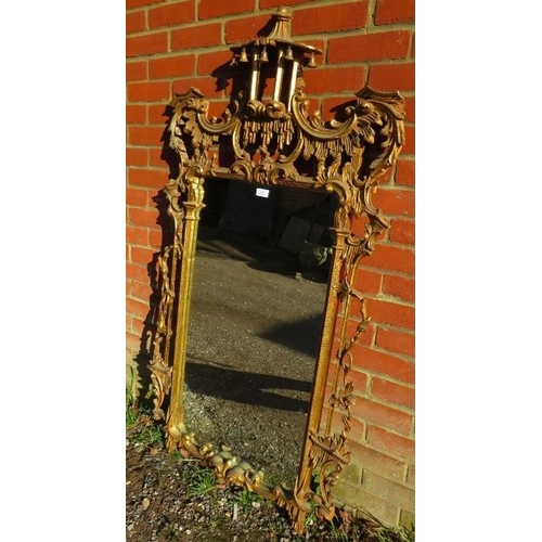 709 - A large vintage wall mirror in the Chippendale taste, within a highly decorative acanthus carved and... 