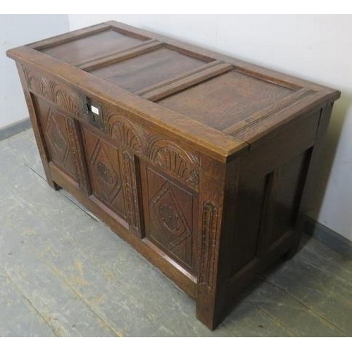 713 - An early 18th century panelled oak coffer, having internal candle box, arcaded frieze and diamond ca... 