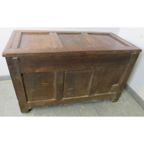 713 - An early 18th century panelled oak coffer, having internal candle box, arcaded frieze and diamond ca... 