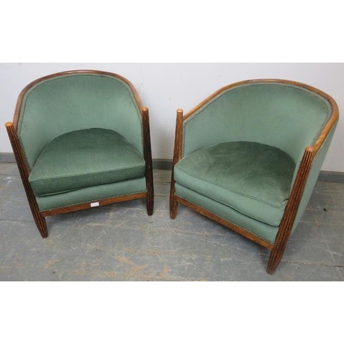 714 - A pair of French Art Deco Period tub chairs, the tapered fluted front supports with domed finials, r... 