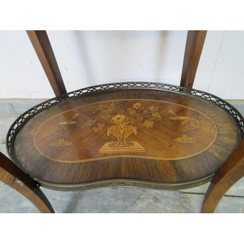 715 - A 19th century French tulipwood and kingwood crossbanded oval two-tier table, having profuse marquet... 