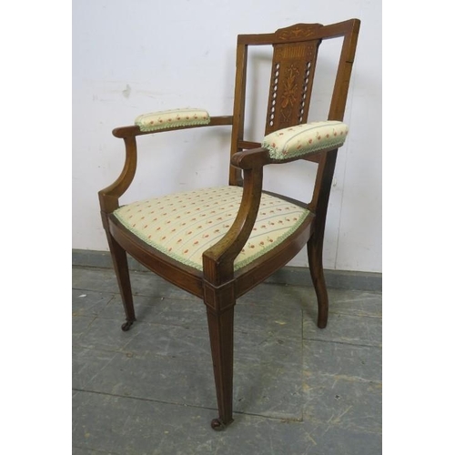 716 - An Edwardian mahogany elbow chair strung with boxwood, having marquetry inlaid and pierced backsplat... 