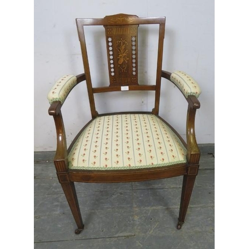 716 - An Edwardian mahogany elbow chair strung with boxwood, having marquetry inlaid and pierced backsplat... 