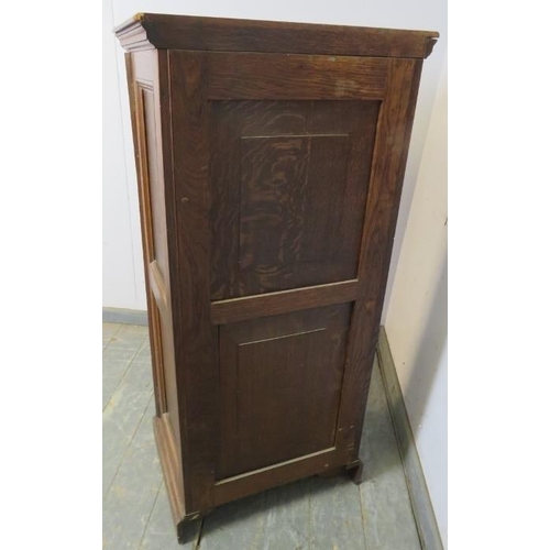 719 - A 19th century oak Wellington chest, having seven long drawers with fancy brass handles, flanked by ... 