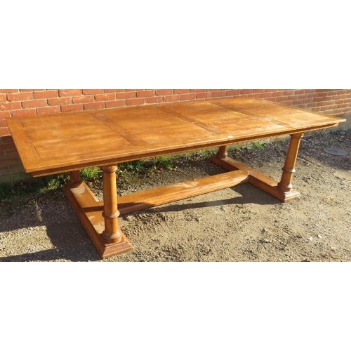 720 - A large bespoke light oak refectory style dining table, planked top on four tapering column supports... 