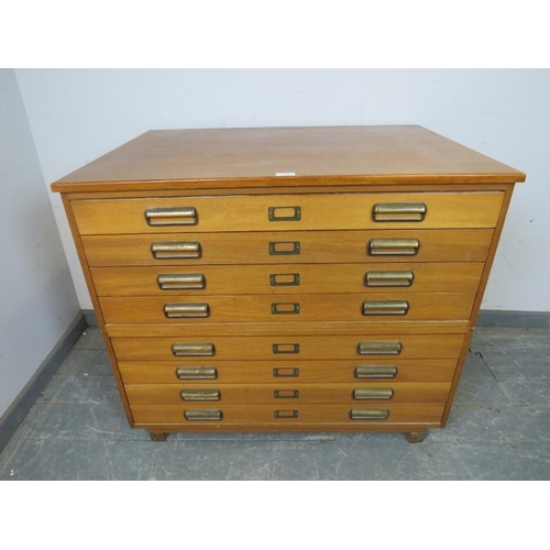 722 - A mid-century teak planning chest of usable proportions, having eight long drawers with brass scallo... 