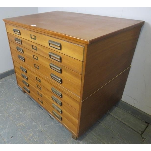 722 - A mid-century teak planning chest of usable proportions, having eight long drawers with brass scallo... 