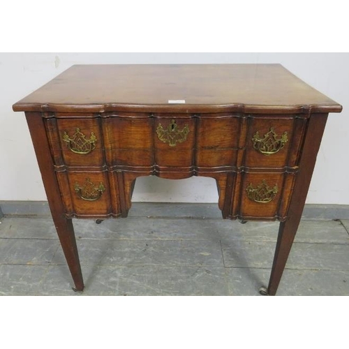 729 - 729	A good 18th century serpentine fronted mahogany low boy, possibly Irish, housing one long and tw... 