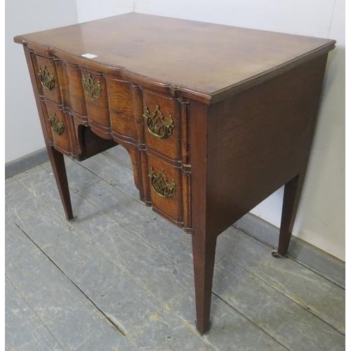 729 - 729	A good 18th century serpentine fronted mahogany low boy, possibly Irish, housing one long and tw... 