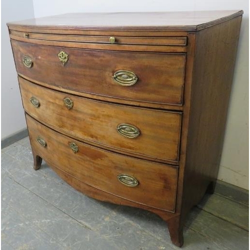 731 - A George III mahogany bow-fronted chest with reeded edge, having a pull-out brushing slide over thre... 