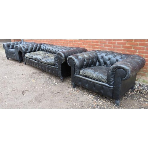 734 - A vintage three-piece Chesterfield suite, comprising a three-seater sofa and two club armchairs, uph... 