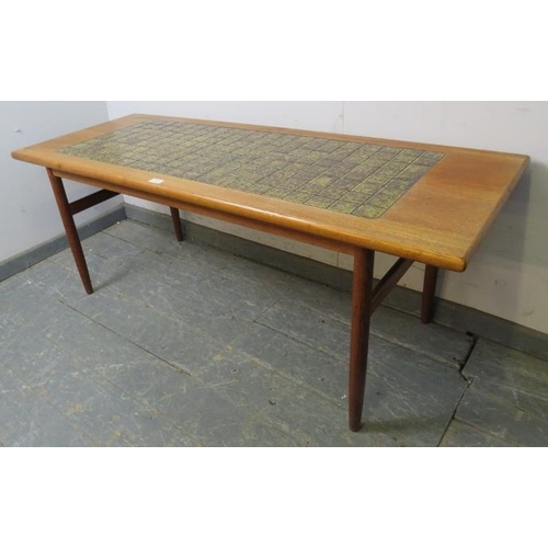 737 - A mid-century Danish teak rectangular coffee table, the top with inset green tiles, on turned suppor... 