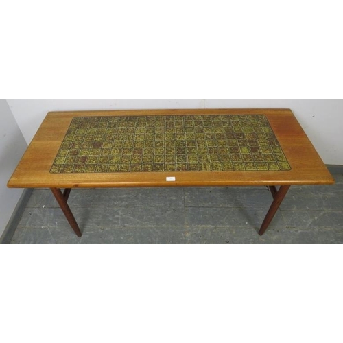 737 - A mid-century Danish teak rectangular coffee table, the top with inset green tiles, on turned suppor... 