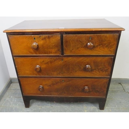 738 - A 19th century flame mahogany chest of two short over two long graduated drawers with turned wooden ... 