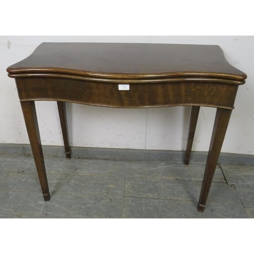 745 - A Georgian mahogany serpentine fronted folding card table, on chamfered tapering square supports. 
H... 