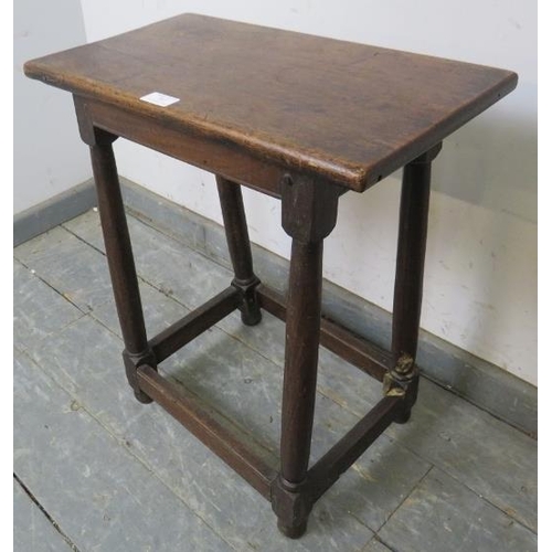 747 - An 18th century joint stool, the loose mahogany top on plain turned oak supports united by stretcher... 