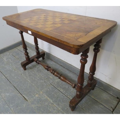 749 - A Victorian walnut inlaid chess table, the crossbanded top with marquetry decoration depicting butte... 