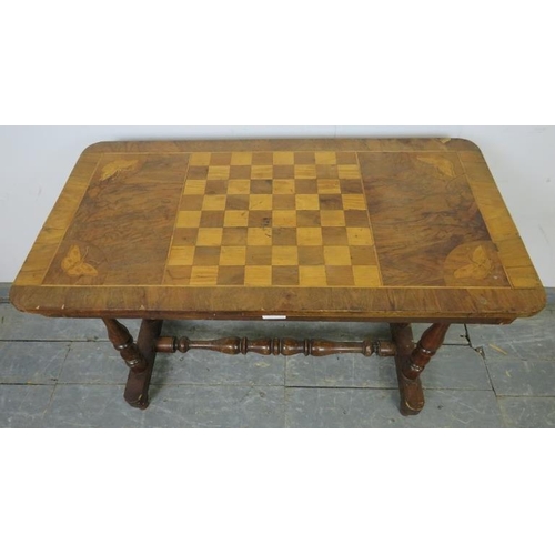 749 - A Victorian walnut inlaid chess table, the crossbanded top with marquetry decoration depicting butte... 