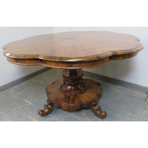 750 - A Victorian rosewood tilt-top breakfast table, the top with lobed edge, on a bulbous octagonal pedes... 