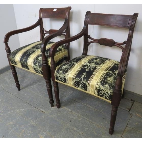 752 - A matched pair of Georgian mahogany elbow chairs, reupholstered in green and gold antique style mate... 