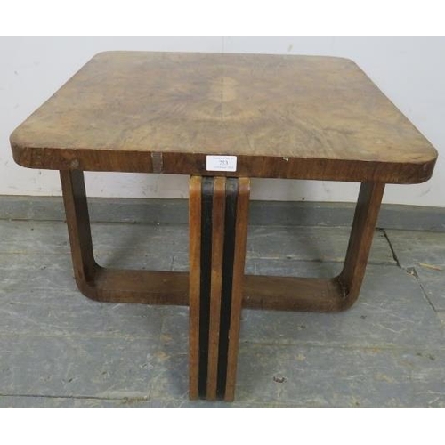 753 - An Art Deco Period walnut occasional table, the quarter veneered top on interlocking curved supports... 