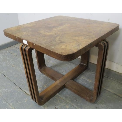 753 - An Art Deco Period walnut occasional table, the quarter veneered top on interlocking curved supports... 