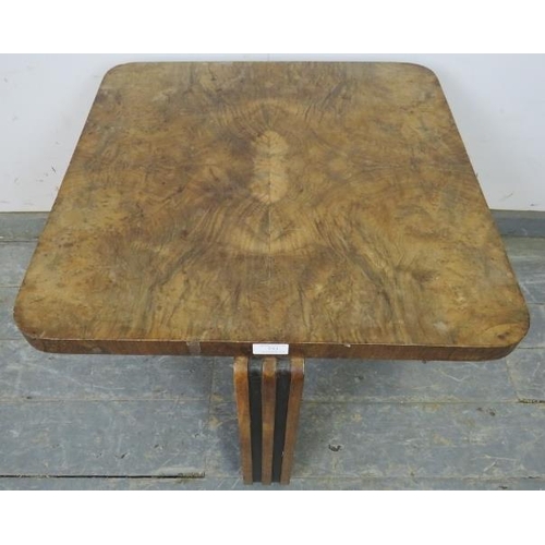 753 - An Art Deco Period walnut occasional table, the quarter veneered top on interlocking curved supports... 