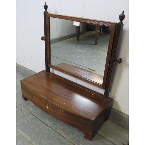 755 - A Regency Period mahogany gentlemen’s swing vanity mirror, the reeded uprights with turned finials, ... 