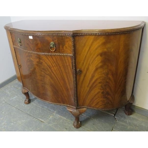 767 - A good quality antique flame mahogany serpentine fronted sideboard in the Georgian taste, housing on... 