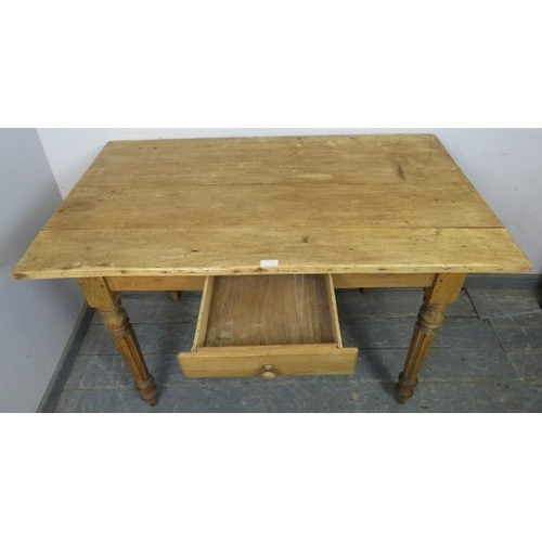 769 - An antique stripped pine kitchen table with single central drawer, on tapered fluted supports. 
H73c... 