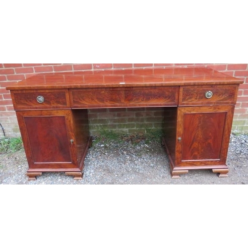 771 - A Regency period flame mahogany pedestal sideboard of good colour, having central blind drawer flank... 