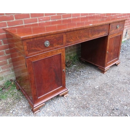 771 - A Regency period flame mahogany pedestal sideboard of good colour, having central blind drawer flank... 