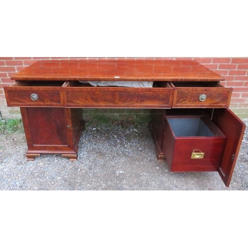 771 - A Regency period flame mahogany pedestal sideboard of good colour, having central blind drawer flank... 