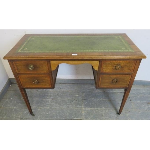 774 - An Edwardian mahogany writing desk, the top with inset gilt tooled leather writing surface, housing ... 