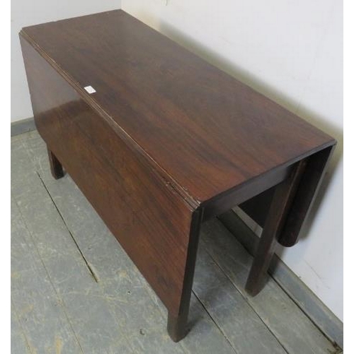 776 - A Georgian Cuban Mahogany drop leaf dining table, on inner-chamfered square supports with reeded cor... 