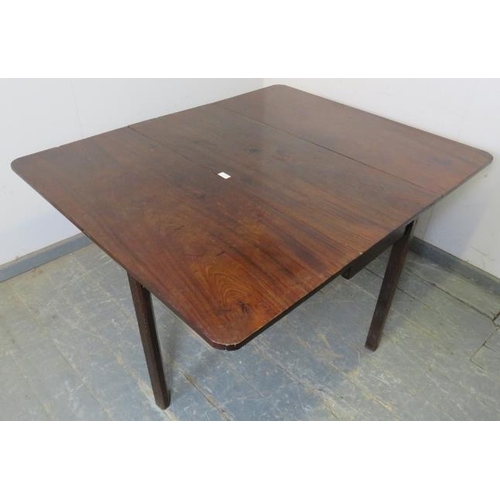 776 - A Georgian Cuban Mahogany drop leaf dining table, on inner-chamfered square supports with reeded cor... 