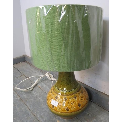 779 - A vintage mid-century Italian ceramic table lamp of baluster form, having incised decoration, finish... 