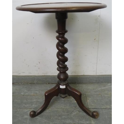 781 - Early Victorian mahogany circular wine table, the dished top on a barley twist column with scrolled ... 