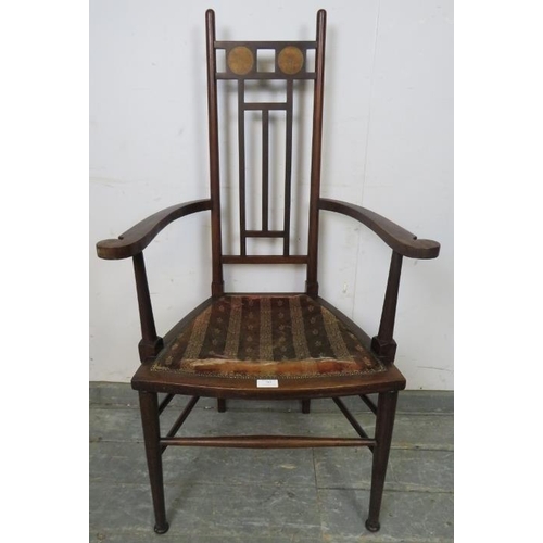 785 - An Arts & Crafts Period mahogany elbow chair.