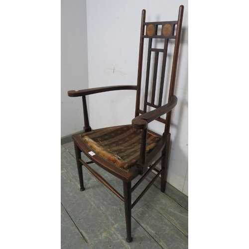 785 - An Arts & Crafts Period mahogany elbow chair.