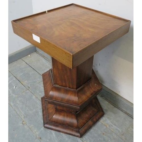 786 - A Victorian walnut pedestal, the square top raised on a hexagonal column with curved side mouldings.... 