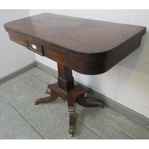 799 - A Regency Period rosewood turnover card table, on a tapered square column with quatreform base termi... 