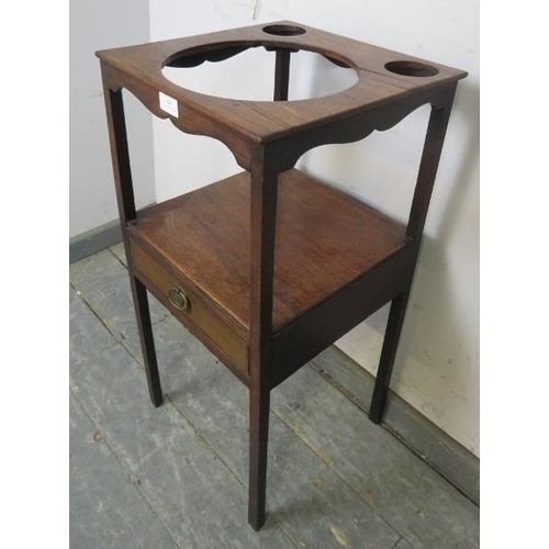 805 - A George III mahogany two-tier wash stand, the single drawer with reeded edge, on square supports. 
... 