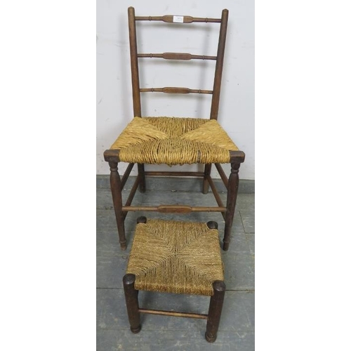 809 - An antique elm country chair with rush seat and double side stretchers, together with a small rope s... 