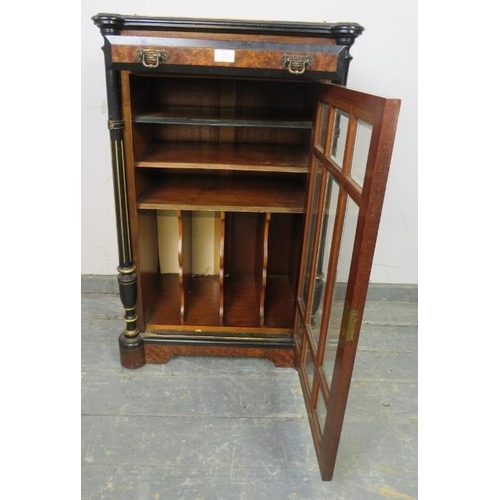 815 - A late Victorian burr walnut ebonised and inlaid music cabinet, having brass ¾ gallery above one lon... 