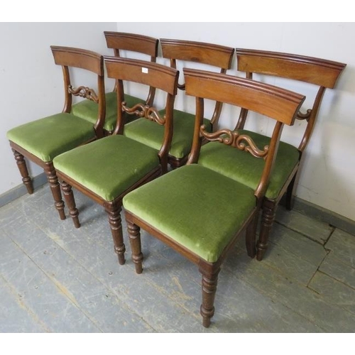 817 - A set of six Victorian mahogany dining chairs, having carved and pierced backs, the loose seat pads ... 