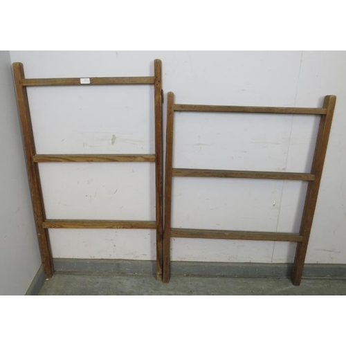 825 - A matched pair of antique pine folding towel rails. 
H107cm W61cm D4cm (approx).
Condition report: S... 